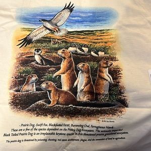 Prairie dog design on a cream colored T-shirt